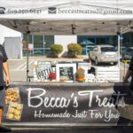 Outdoor stall selling homemade jams called Becca's Treats.