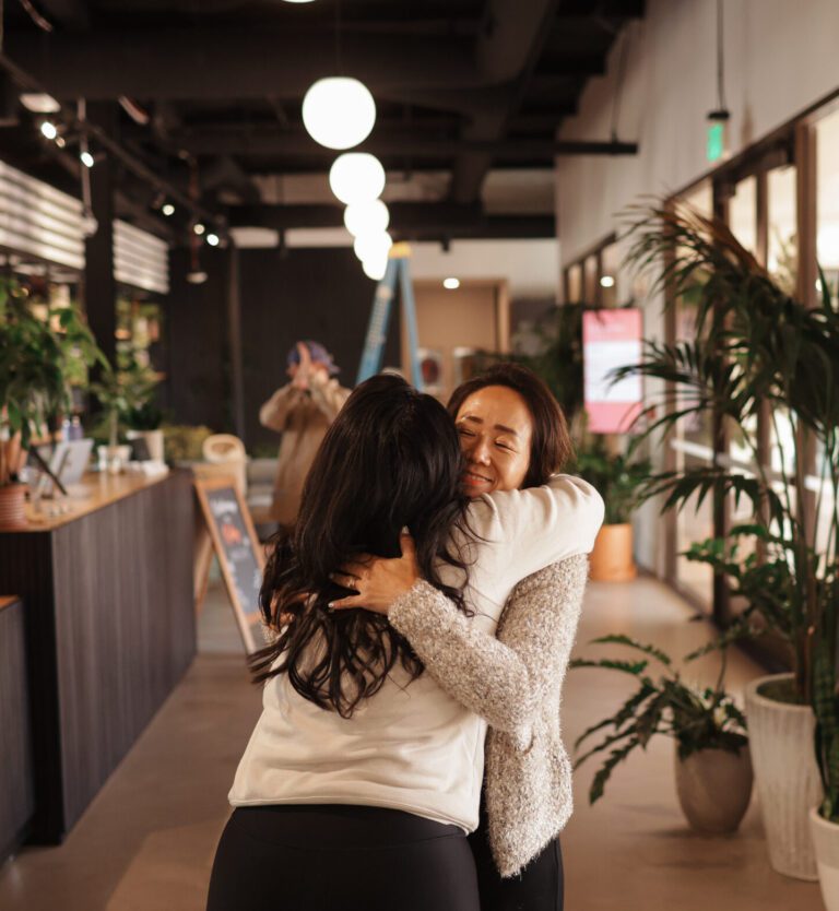 Warm hug in bright lobby space