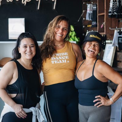 Trio laughing in fitness studio
